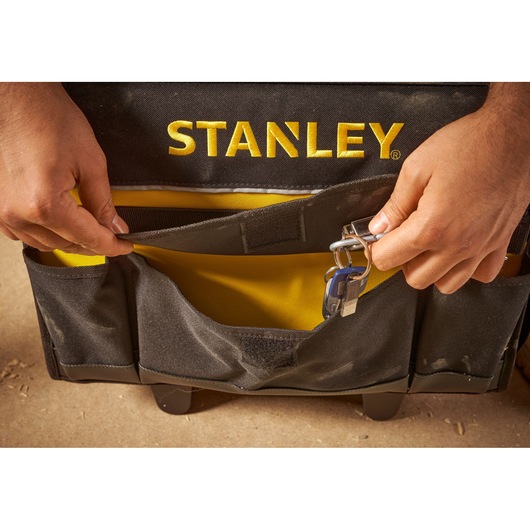 STANLEY 1-97-515 tool bag front pocket with key clip, close-up photo.