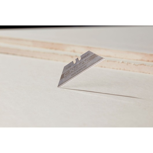 Photo of STANLEY 8-11-800 utility blade on white background, sharp edge visible, product photography angle.