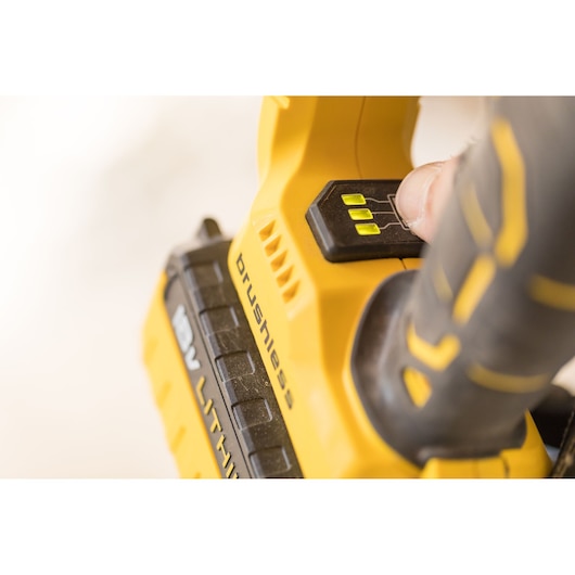 STANLEY FMCD900B cordless brushless tool close-up showing battery indicator lights and power button.