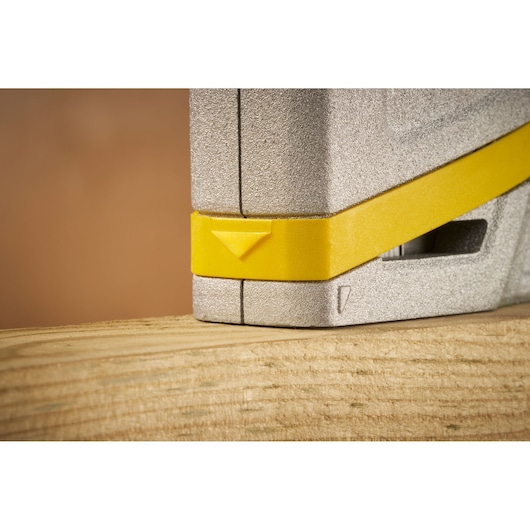 STANLEY FMHT70443-0 photography, close-up of yellow and silver tool on wooden surface.