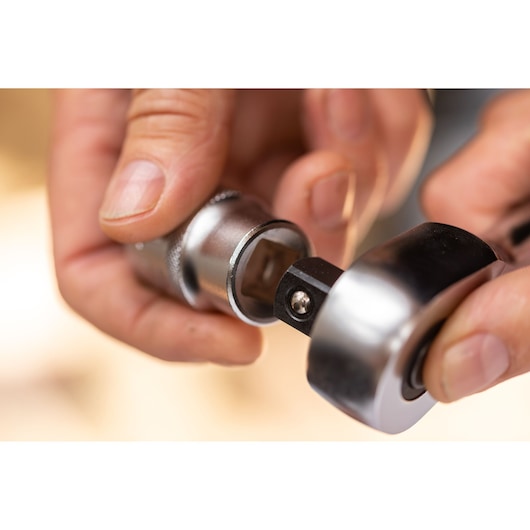 STANLEY FMMT82681-0 ratchet and socket tool in hand, close-up view showing connection.