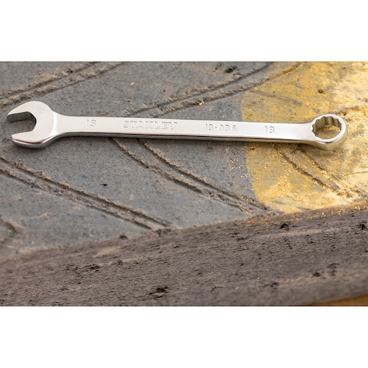 Stanley FMMT82844-0 combination wrench, silver color, shown resting on textured gray surface.