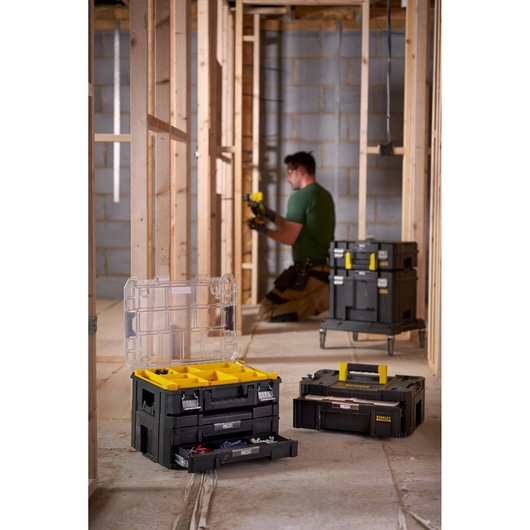 STANLEY FMST1-71968 stackable toolboxes and organizers in a construction site, open and closed views.