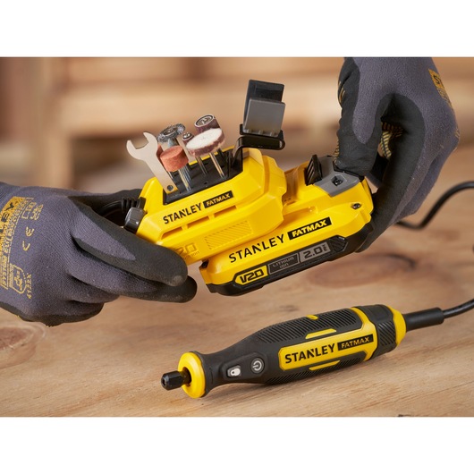STANLEY SFMCE030B rotary tool kit with accessories, close-up on workspace, photo from above.