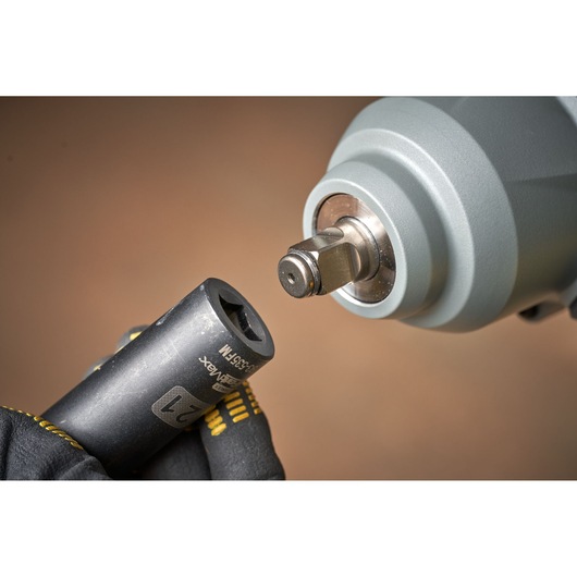 STANLEY SFMCF940M1 impact wrench front close-up with socket attachment held by gloved hand.