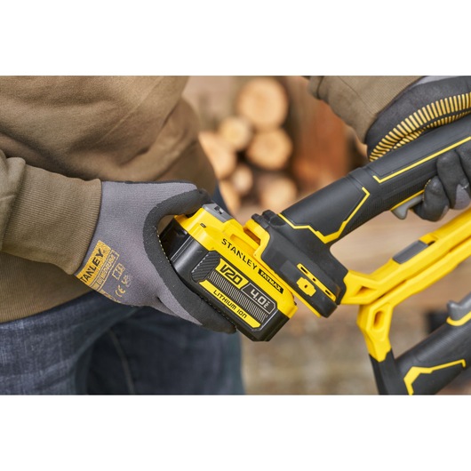 Photo of STANLEY SFMCPS515B battery-powered tool close-up, V20 4.0Ah Lithium-Ion battery being inserted.