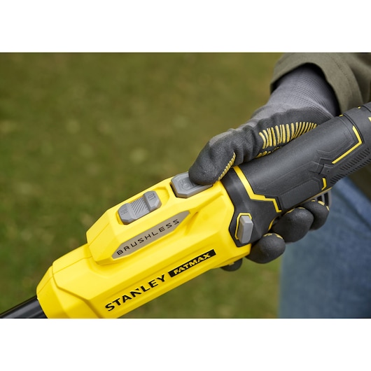 Photo of STANLEY SFMSTB930B brushless tool handle with glove, close-up of yellow and black controls.