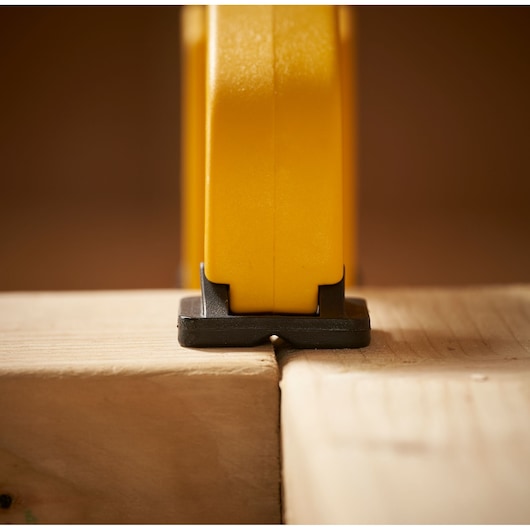 STANLEY STHT0-83200 clamp close-up on wooden boards, front photography.