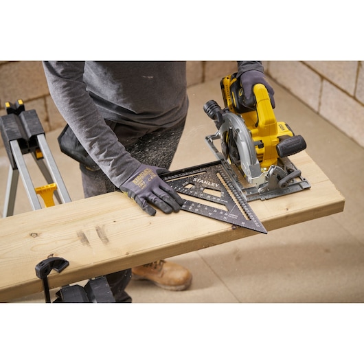 Photo of STANLEY STHT46102-0 photography square used for measuring on wooden plank during cutting.