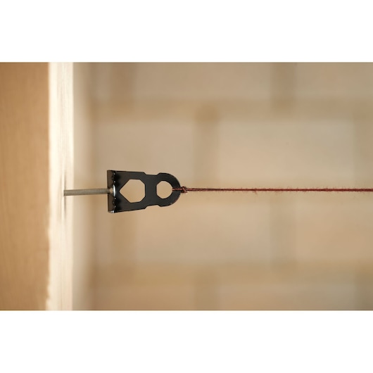 STANLEY STHT47611-0 line level photography, close-up view showing string and metal tool.
